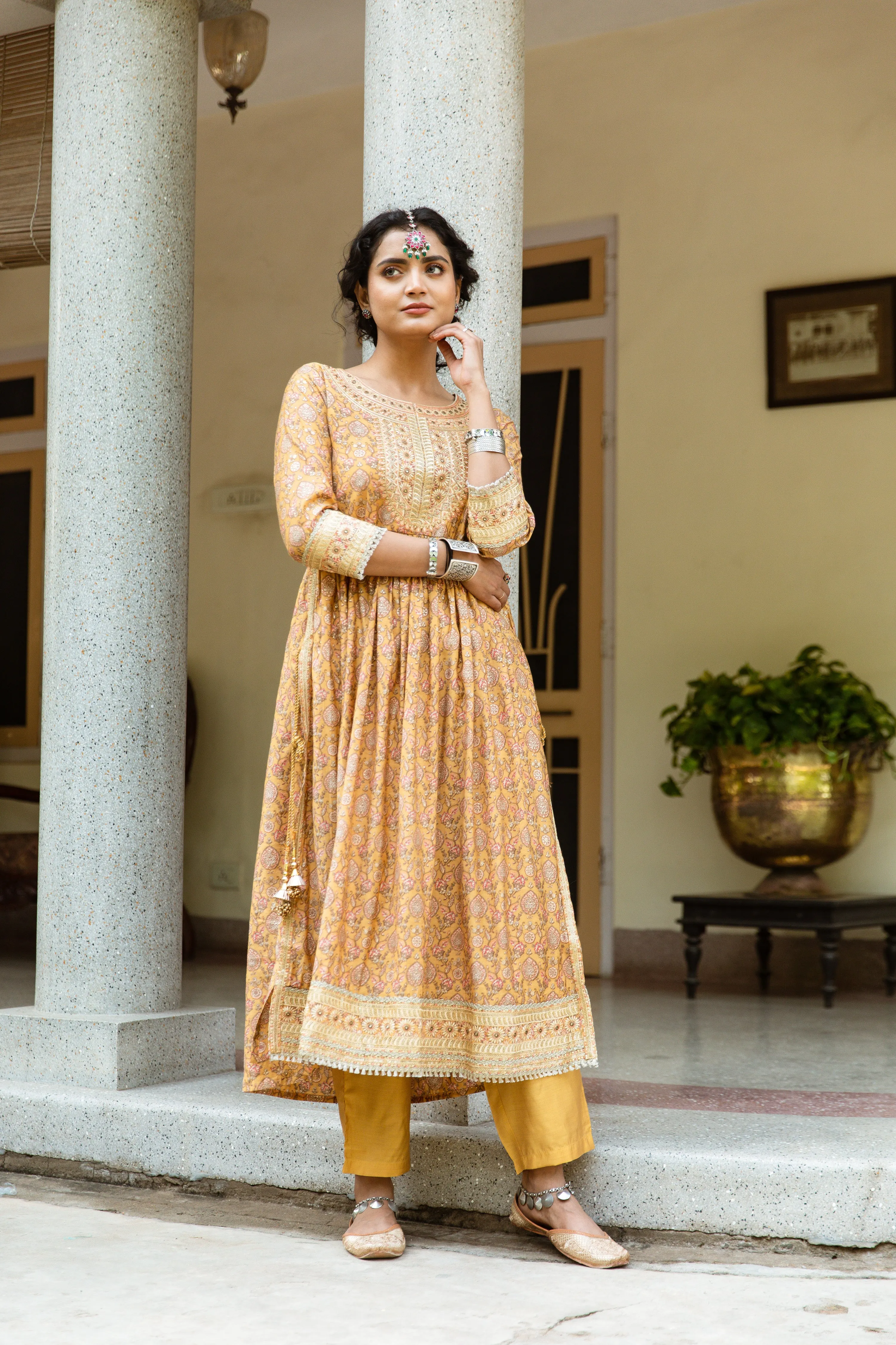 Women Mustard Chanderi Nyara Cut A-Line Kurta Trouser Dupatta & Fancy Potli Set